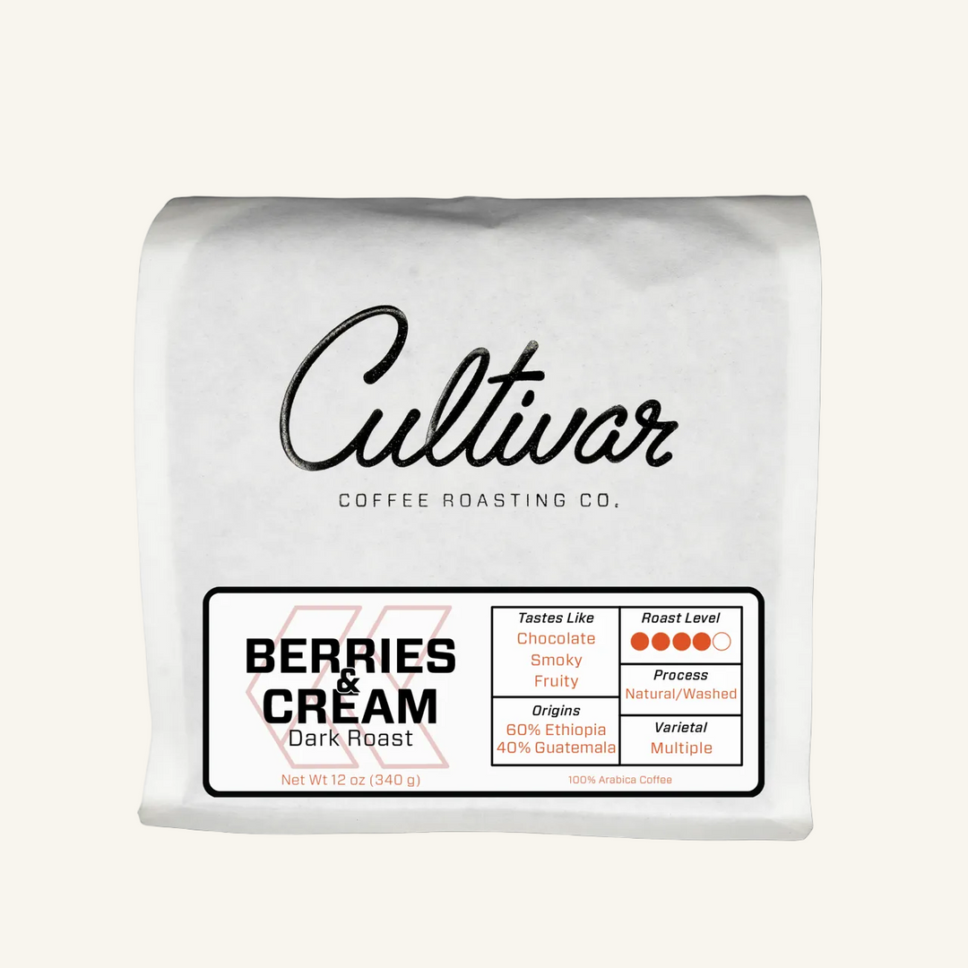 Retail bag of Cultivar Coffee Roasting Co.'s Berries & Cream Dark Roast freshly roasted coffee beans